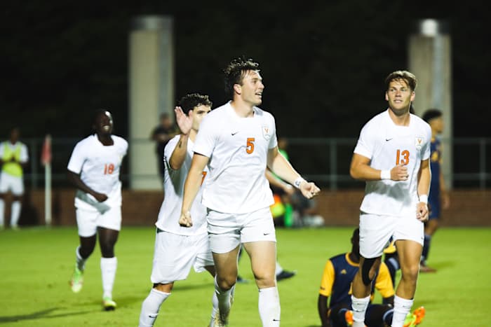 Junior defenseman Aidan O'Connor celebrates after scoring a goal for the Virginia men's soccer team.